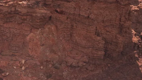 Views of rocky terrain with layers of red earth and stone formations Stock Footage 337874991