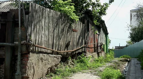 Views of a russian village. Exterior of an old unpainted wooden fence. HD Stock Footage 68738853