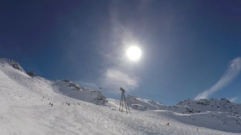 Views Of The Ski Slope In Mountain Where Many Skiers Skiing Down In The Sunshine Stock Footage 94415078