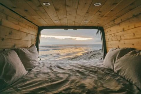 Views of sunset from open doors of sprinter van in Baja, Mexico. Stock Photos