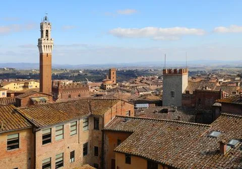 Views of the tower called Torre del Mangia in the city of Siena and the ter.. 写真素材