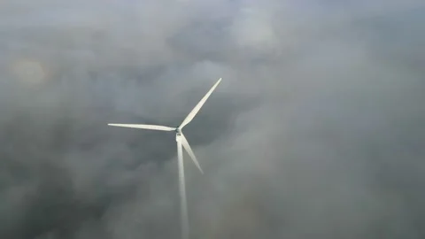 Views of the wind farm from a height. Aerial View Of The Windmill In Fog Stock Footage 144040590