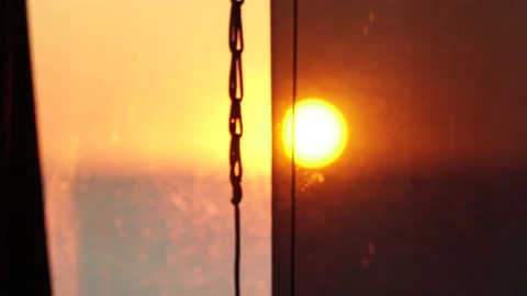 ViewView from the ship's illuminator to the sea roadstead at sunset. Stock Footage 138831471