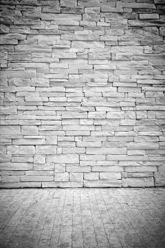 Vignette Light loft wall of stone blocks with floor Stock Photos