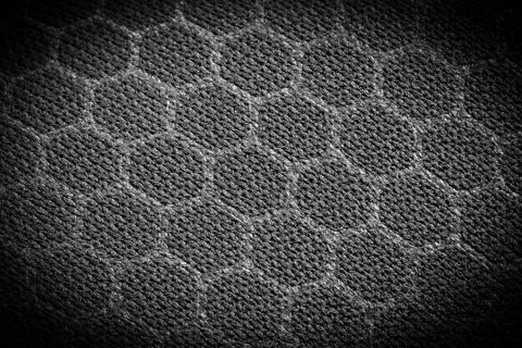 Vignetted textile material with a hexagonal pattern Stock Photos