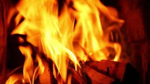 Vigorous fire flames with intense orange and yellow color display Stock Footage 316410699