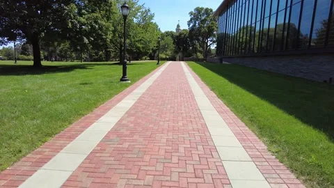 Viiew of a long red brick sidewalk Stock Footage 159440165