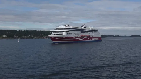 Viking Line ferry navigates calm waters near coastal landscape in Estonia Vídeos de archivo 343188899