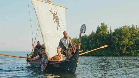 A Viking Man Stands Aboard the Drakkar Dressed in Armor Stock Footage 163963824