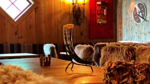 Viking themed restaurant interior with drinking horn and fur seats in Flam Stock Footage 341536059