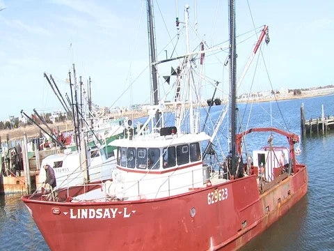 VIKING VILLAGE DOCK WITH SCALLOPER PULLING AWAY2 Stock Footage 76618628