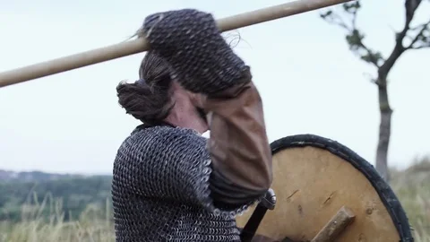 A Viking warrior throws a spear during an attack. Stock Footage 81342309