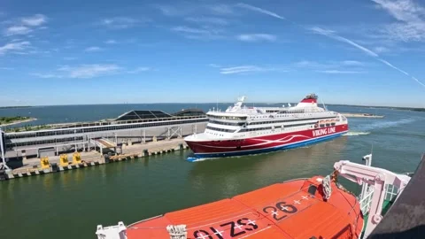 Viking XPRS passenger ferry docking at Port of Tallinn terminal on sunny day Stock Footage 340329610