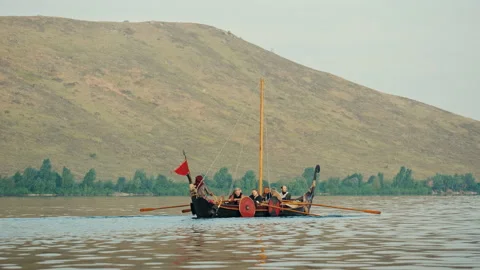 Vikings Row on Drakkar in the Middle of the River. Medieval reconstruction. Stock Footage 163656547