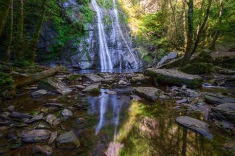 Vilagocende waterfall reflected in the stream Stock Photos