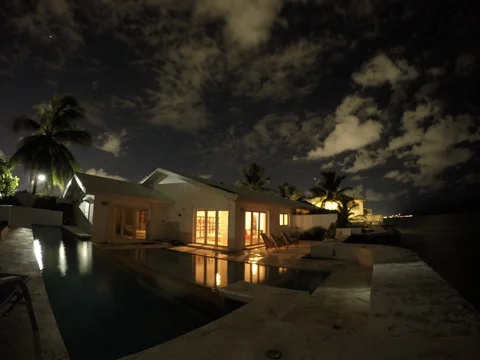 Villa with clouds at night Stock Footage