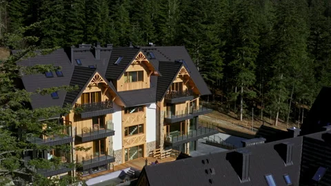 Villa Or Apartment Complex With Traditional Wooden Architectural Elements In Stock Footage 332684877