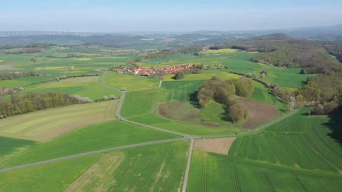 The village of Archfeld between the fields in North Hesse Stock Footage 240645986
