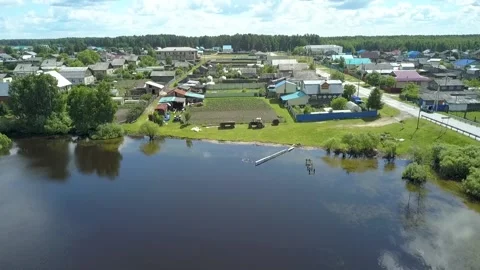 Village on the edge of the lake Stock Footage 139345913