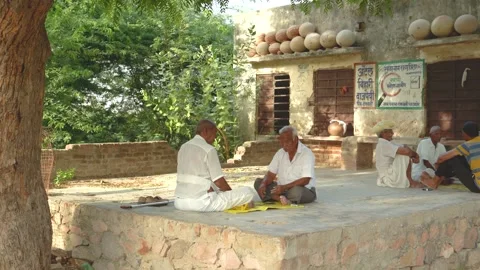 Village Elders Playing Cards on Platform Stock Footage 325090480