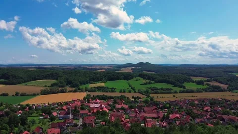Village in Germany infront of two mountains on the horizon Stock Footage 313895791