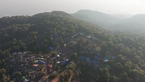 Village life in basic huts among wild mountain trees, Thailand Stock Footage 309113947