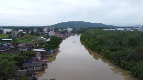 The village is located on the edge of the river, the river looks dirty Stock Footage 278570525