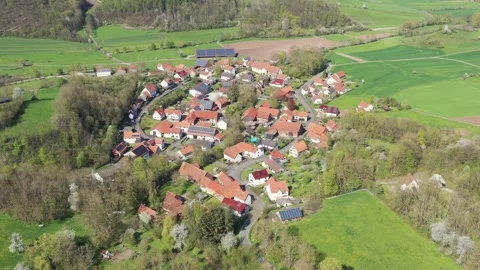 The village of Lüderbach between the fields in North Hesse Stock Footage 240499793