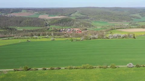 The village of Lüderbach between the fields in North Hesse Stock Footage 240646858