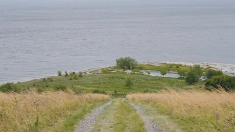 Village path in the field from the mountain to the river Stock Footage 318713623