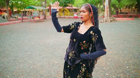 Village performer sings while showcasing folk routine Stock Footage 312729730