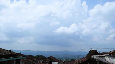 Village Rooftops with Cloudy Sky. Stock Footage 289434628