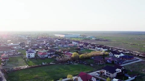 A village at sunset, captured from a drone's perspective. Video stock 272993657