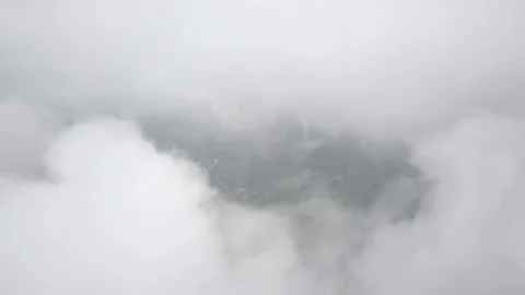 Village surrounded by clouds 2k7 01 Stock Footage 146687288