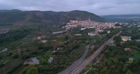 Village surrounded by crops at dawn with a cloudy sky Stock Footage 214115355