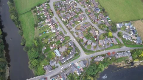 Village surrounded by river, old bridge over water Stock Footage 166695015