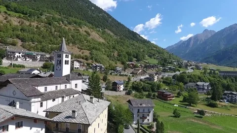 Village in the valley of the mountain Stock Footage 79564491
