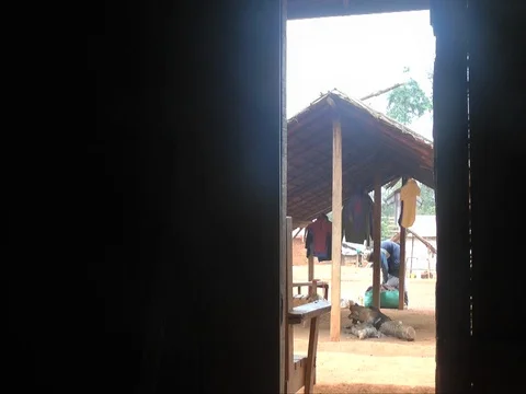 Village view from inside a hut Stock Footage 80615667