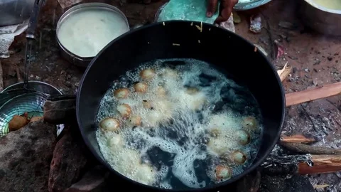 A villager makes local snacks Stock Footage 80989192