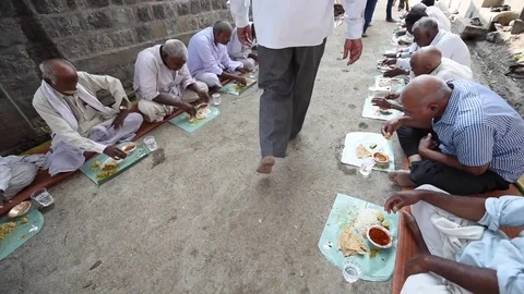 Villagers are having common cooked and served food Stock Footage 77193120