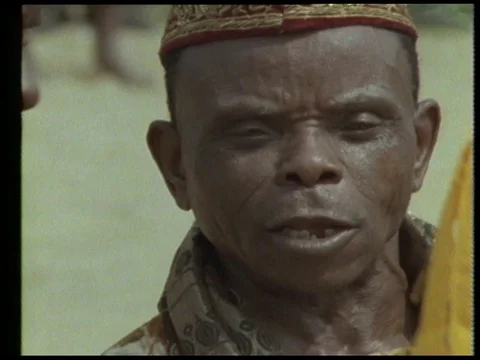 Villagers playing instruments and dancing in costumes, 1990 Stock Footage 136674068