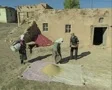 Villagers pouring grain SD Footage
