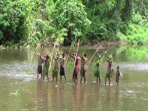 Villagers shoot bow/arrows Stock Footage 3545246