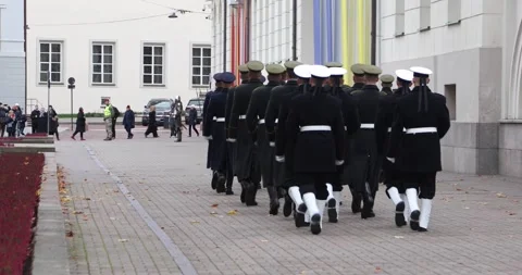 Vilnius honor guard marching past palace toward medieval guards Stock Footage 321050225