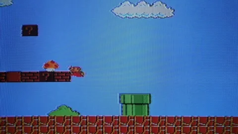 VILNIUS, LITHUANIA - APRIL 26, 2024: Super Mario video game level on analog TV Stock Footage 278509753