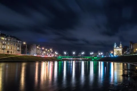 Vilnius Skyline at Night with Reflection of Neris River Stock Photos