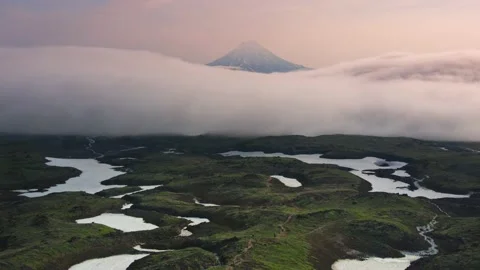 Vilyuchinsky volcano with clouds at sunrise. Video stock 180560455