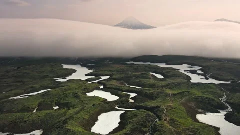 Vilyuchinsky volcano with clouds at sunrise. Stock Footage 180561470