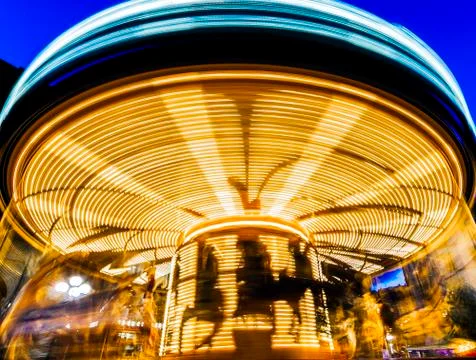 Vinatage carousel at night in Florence Italy with light trails Stock Photos