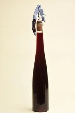 Vine bottle with corkscrew Stock Photos